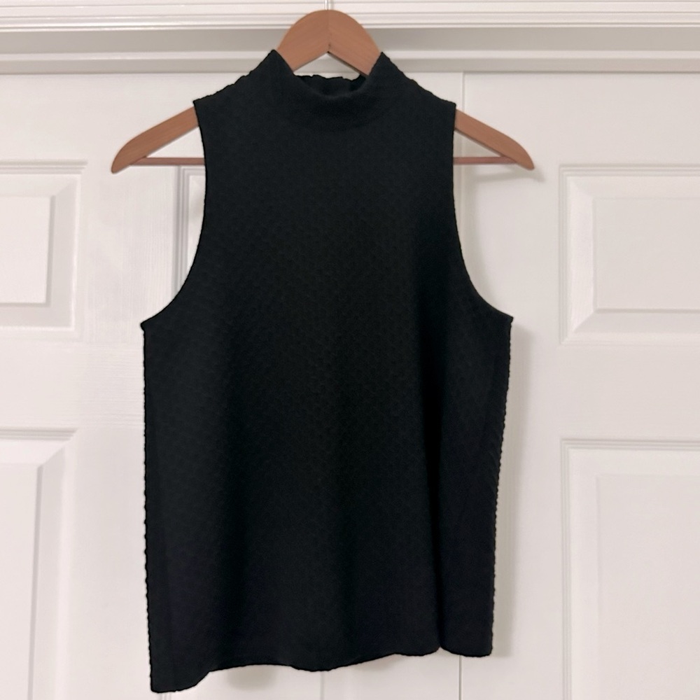 Black sleeveless mock t-neck shirt. Size Small